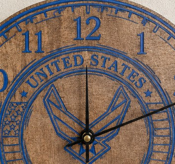 Wooden clock with blue engraving of the United States Air Force emblem and numbers.
