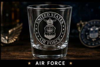 Glass with 'United States Air Force' engraving on a wooden surface