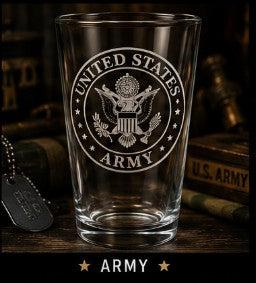 Clear glass with United States Army emblem on a wooden surface with military-themed decor.