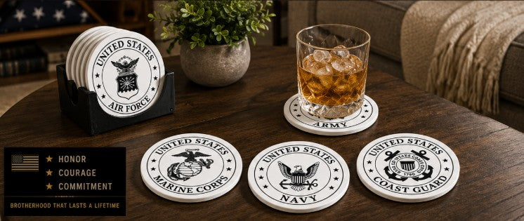 Set of coasters with U.S. military emblems on a wooden table with a glass of whiskey.