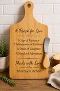 Wooden cutting board with engraved text on a kitchen counter