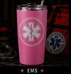 Pink tumbler with EMS logo on a dark background