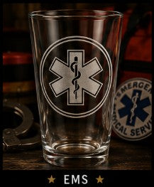 Clear glass with EMS symbol on a dark background