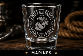 Glass with 'United States Marine Corps' logo on a wooden surface
