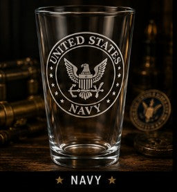 Clear glass with United States Navy emblem on a wooden surface with military-themed decor.